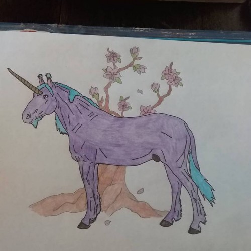 Unicorn with cherry blossom tree