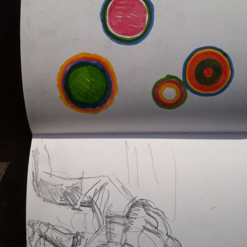 Sketchbook page: rugby players and coloured disks