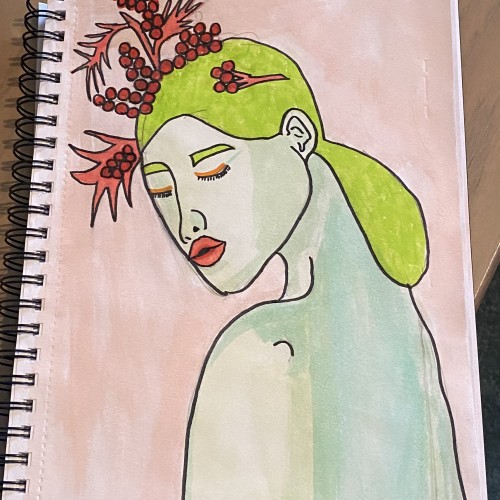 Green woman with flowers in her hair