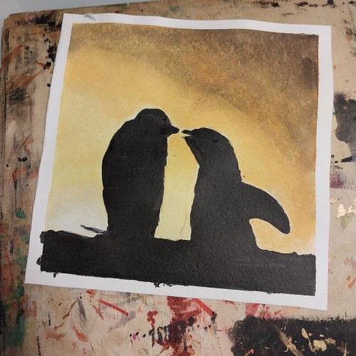 Penguins in sunset